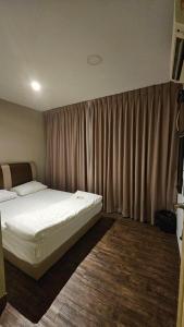 Kama o mga kama sa kuwarto sa Cute Hotel