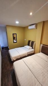 Kama o mga kama sa kuwarto sa Cute Hotel