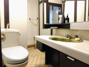 a bathroom with a white toilet and a sink at Kyoto G in Kyoto +29 photos