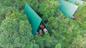 an overhead view of a green tent in the trees at Villa Hillcrest Weligama in Weligama