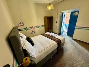 Postel nebo postele na pokoji v ubytování Way Kap Hostel Cusco
