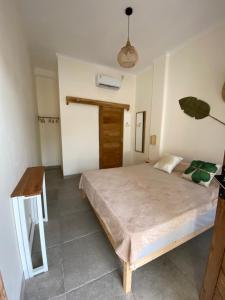 Ліжко або ліжка в номері Sastro Place