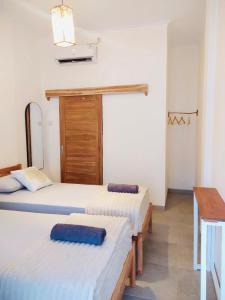 Ліжко або ліжка в номері Sastro Place