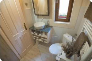 a small bathroom with a sink and a toilet at Kuća za odmor Brigitaa in Jezera +12 photos