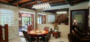 a dining room with a table and chairs at Loerie Escape - Marloth Park in Marloth Park