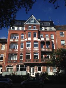 a large red brick building with a lot of windows at Luxus Penthouse Waterview in Kiel