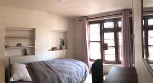 Postel nebo postele na pokoji v ubytování Samriddhi HomeStay