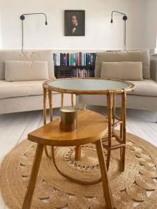 a living room with a coffee table and a couch at Beachhotel Atmosphere With Stunning Seaview in Idestrup