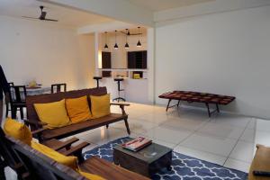 a living room with a couch and a table at Bethel Homestay Thiruvallam in Trivandrum