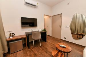 Kuchyň nebo kuchyňský kout v ubytování Inventree Aranya Resort & Spa