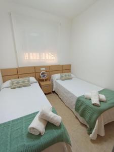 Postel nebo postele na pokoji v ubytování Torremar 34