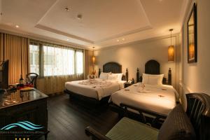 Voodi või voodid majutusasutuse Hanoi Emerald Waters Hotel Valley toas