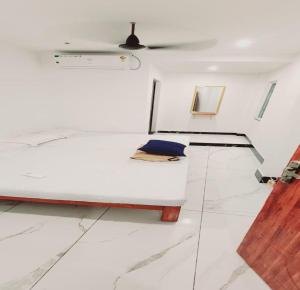 Postel nebo postele na pokoji v ubytování Minnal Residency