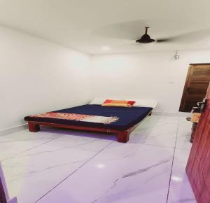 Postel nebo postele na pokoji v ubytování Minnal Residency