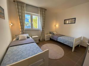 Postel nebo postele na pokoji v ubytování Adria apartmani