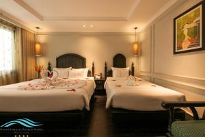 Voodi või voodid majutusasutuse Hanoi Emerald Waters Hotel Valley toas