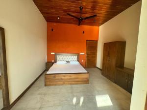 a bedroom with a bed and a wooden ceiling at Liyadi Addalaichenai in Addalachenai +54 photos