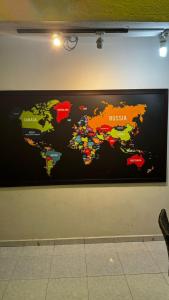 a map of the world on a wall at check in hotel in Brinchang