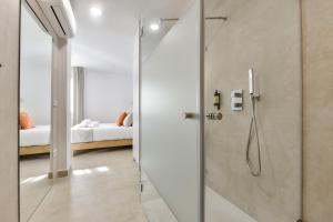 a shower with a glass door in a bathroom at MIMAR ALTEA ROOMS - Tranquil in Altea