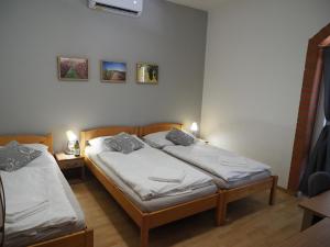 Postel nebo postele na pokoji v ubytování Resort Zajíci ze Zaječí