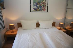 Postel nebo postele na pokoji v ubytování Haus Möösgraav