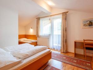 Ένα ή περισσότερα κρεβάτια σε δωμάτιο στο Apartment in Tyrol near Ski Lift