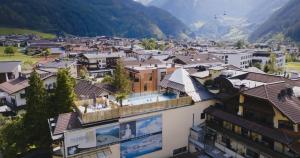 a view of a town in the mountains at MANNI das Hotel in Mayrhofen