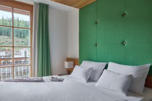 Voodi või voodid majutusasutuse Falkensteiner Aktiv & Familienhotel Cristallo Superior toas