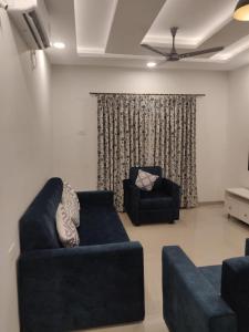 Khu vực ghế ngồi tại Blueberry Comfort stay 2BHK Luxury Apt