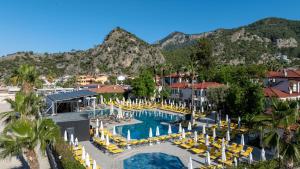 an aerial view of a resort with a pool and chairs at Sundia By Liberty Oludeniz in Oludeniz