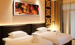 Postel nebo postele na pokoji v ubytování MonMonBoutique Hotel