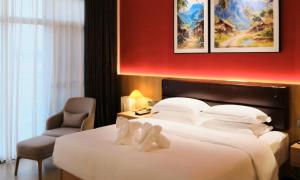 Postel nebo postele na pokoji v ubytování MonMonBoutique Hotel
