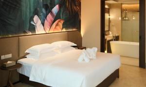 Postel nebo postele na pokoji v ubytování MonMonBoutique Hotel