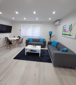 Posezení v ubytování Blue Apartman