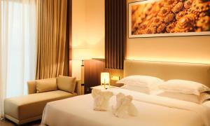 Postel nebo postele na pokoji v ubytování MonMonBoutique Hotel