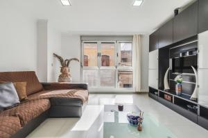 a living room with a couch and a coffee table at Vivienda vacacional sol in Las Palmas de Gran Canaria