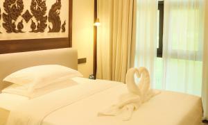 Postel nebo postele na pokoji v ubytování MonMonBoutique Hotel
