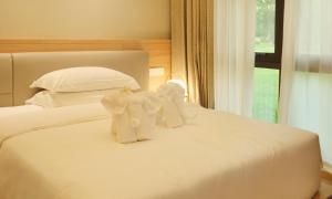 Postel nebo postele na pokoji v ubytování MonMonBoutique Hotel