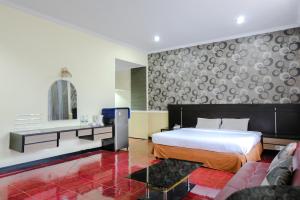 Bandung Permai Hotel Jember客房内的一张或多张床位