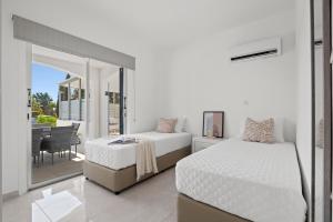 Postel nebo postele na pokoji v ubytování Adamante Luxury Villa by Nomads + 18 fotografií
