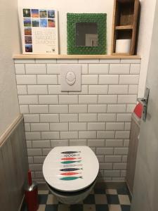 a bathroom with a white toilet in a room at Maison typique de pêcheur in Noirmoutier-en-l'lle