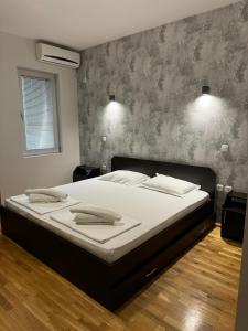 Postel nebo postele na pokoji v ubytování Apartments Philip II