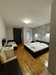 Postel nebo postele na pokoji v ubytování Apartments Philip II