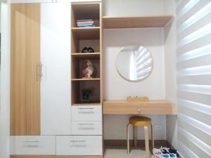 a dressing room with a desk and a mirror at SMDC Style Residences Condo Unit in Iloilo City