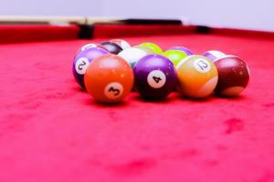 a group of pool balls on a pool table at Stunning 3-Bed House in Lagos in Lagos
