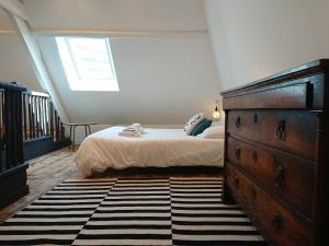 Postel nebo postele na pokoji v ubytování Gîte d'Hublange