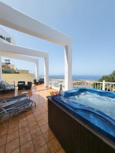 a swimming pool on top of a building at La casita in Los Menores