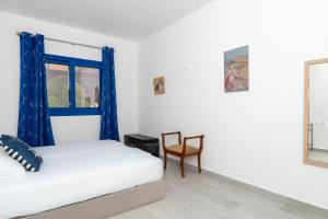 Postel nebo postele na pokoji v ubytování Stratos by mRoom Apartments
