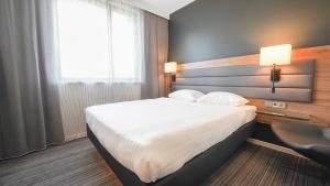 Postel nebo postele na pokoji v ubytování X Hotel