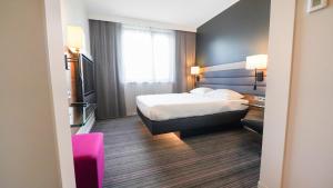 Postel nebo postele na pokoji v ubytování X Hotel